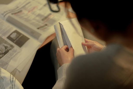 Woman opening envelope